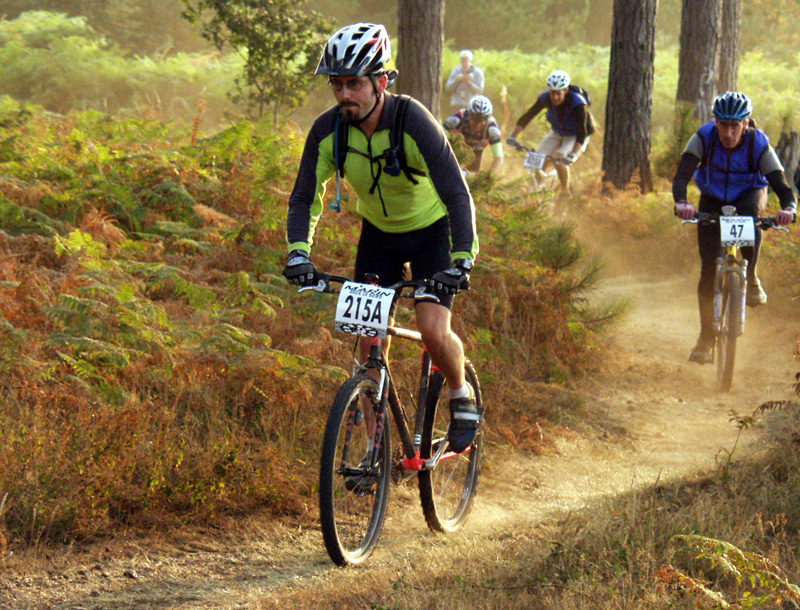 Man mountain biking in the woods