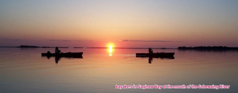 Kayakers in Saginaw Bay at the mouth of the Sebawing River